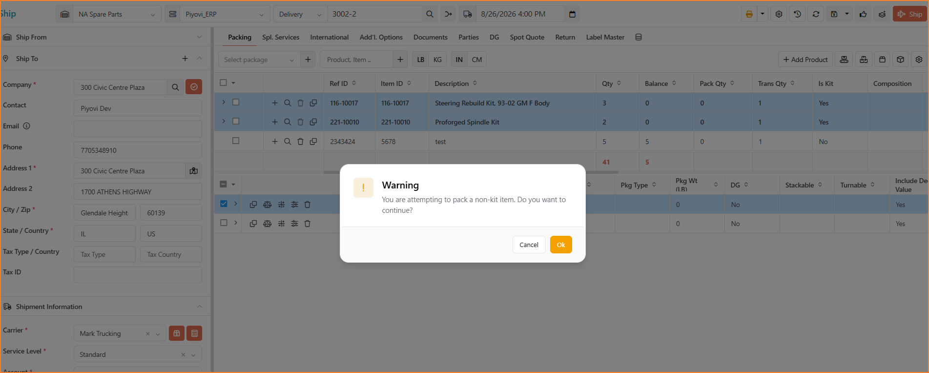 Screenshot of a warning dialog reading “You are attempting to pack a non-kit item. Do you want to continue?” with Cancel and Ok buttons, shown over the Packing screen item grid